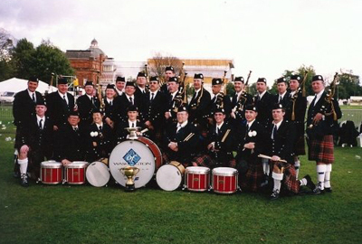 Tim Carey at Wold Championship with other bagpipers
